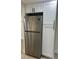 View of the kitchen featuring stainless steel refrigerator and white cabinets at 2217 Azalea Ct, Lakeland, FL 33815