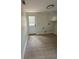The laundry room with a door and new flooring at 2217 Azalea Ct, Lakeland, FL 33815