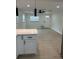An Open kitchen/living room layout with a kitchen island and modern ceiling fan at 2217 Azalea Ct, Lakeland, FL 33815
