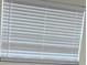 Close up of a modern window with white blinds at 2217 Azalea Ct, Lakeland, FL 33815
