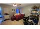 Cozy bedroom with tiled floors, complemented by a dresser, and a comfortable bed at 303 Silk Oak Dr, Kissimmee, FL 34743