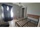 Basic bedroom with light-colored walls and tile flooring, suitable for personalization at 303 Silk Oak Dr, Kissimmee, FL 34743