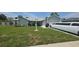 Charming single-story home with well-maintained lawn, landscape accents, and long limousine at 303 Silk Oak Dr, Kissimmee, FL 34743