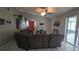 Comfortable living room featuring tile flooring, ample natural light, and a sliding glass door at 303 Silk Oak Dr, Kissimmee, FL 34743
