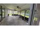 Enclosed patio with ceiling fans offering a comfortable space for outdoor relaxation and entertaining at 303 Silk Oak Dr, Kissimmee, FL 34743