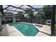 Sparkling screened-in pool and spa area, perfect for outdoor enjoyment and relaxation at 303 Silk Oak Dr, Kissimmee, FL 34743