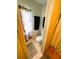 Compact bathroom featuring a toilet and floral shower curtain at 313 Palo Verde Dr, Leesburg, FL 34748