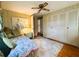 Comfortable bedroom with wood flooring, a ceiling fan, and closet at 313 Palo Verde Dr, Leesburg, FL 34748