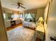 Bright bedroom with a soft rug, window, and vanity at 313 Palo Verde Dr, Leesburg, FL 34748