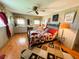 Bright bedroom featuring wood floors, vanity, and decorative accents at 313 Palo Verde Dr, Leesburg, FL 34748