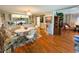 Traditional dining and living rooms with hardwood flooring, decor, and furniture in a cozy home at 313 Palo Verde Dr, Leesburg, FL 34748
