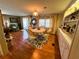 Traditional dining room with hardwood flooring, decor, and furniture in a cozy home at 313 Palo Verde Dr, Leesburg, FL 34748
