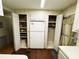 Kitchen pantry with appliances and additional storage in a cozy home at 313 Palo Verde Dr, Leesburg, FL 34748