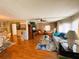 Traditional dining and living rooms with hardwood flooring, decor, and furniture in a cozy home at 313 Palo Verde Dr, Leesburg, FL 34748