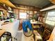 Storage room interior with washer, dryer, bicycle and shelving at 313 Palo Verde Dr, Leesburg, FL 34748