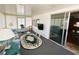Sun room with an area rug, comfortable seating, a television, and sliding glass doors at 313 Palo Verde Dr, Leesburg, FL 34748
