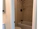 Clean bathroom featuring a shower/tub with tile surround and updated fixtures at 4318 Aqua Vista Dr # K, Orlando, FL 32839