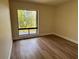 Bright bedroom with a large window offering natural light and balcony access at 4318 Aqua Vista Dr # K, Orlando, FL 32839