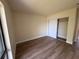 Bedroom with closet and plank floors plus base molding at 4318 Aqua Vista Dr # K, Orlando, FL 32839
