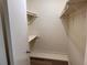 Bright closet with shelves and wooden floors at 4318 Aqua Vista Dr # K, Orlando, FL 32839