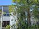 Exterior view of home obscured by foliage at 4318 Aqua Vista Dr # K, Orlando, FL 32839