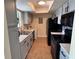 Efficient kitchen with black appliances and light-colored cabinetry, offering modern functionality at 4318 Aqua Vista Dr # K, Orlando, FL 32839