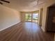 Inviting living room with abundant natural light and views of colorful landscaping and trees at 4318 Aqua Vista Dr # K, Orlando, FL 32839