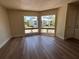 Inviting living room with abundant natural light and views of colorful landscaping and trees at 4318 Aqua Vista Dr # K, Orlando, FL 32839