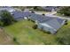 Aerial view of a home with a large, grassy backyard, surrounded by a chain-link fence for privacy and security at 4514 Crichton Ln, Orlando, FL 32806