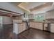 Bright kitchen featuring stainless steel appliances, white cabinets, and a spacious layout at 4514 Crichton Ln, Orlando, FL 32806
