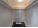 Spacious walk-in closet with white shelving for ample storage of clothes and accessories at 4514 Crichton Ln, Orlando, FL 32806
