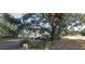 Single story home on a large lot with mature trees and a lake view at 5845 Corbett Ave, Mulberry, FL 33860