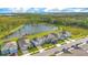 Beautiful aerial view of homes backing to a serene pond with lush landscaping at 6066 Arbor Watch Loop, Orlando, FL 32829