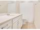 Bright bathroom featuring a quartz countertop, shaker cabinets, and a bathtub at 6066 Arbor Watch Loop, Orlando, FL 32829