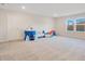 Spacious bonus room featuring neutral carpet, a play tent, and natural light from large windows at 6066 Arbor Watch Loop, Orlando, FL 32829