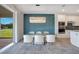 Open concept dining room featuring modern decor and views of the backyard at 6066 Arbor Watch Loop, Orlando, FL 32829
