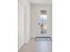Bright foyer featuring tiled flooring, a modern front door, and white trim at 6066 Arbor Watch Loop, Orlando, FL 32829