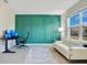 Bright living room with stylish accent wall, modern furniture, and abundant natural light at 6066 Arbor Watch Loop, Orlando, FL 32829