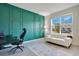 Office with feature wall, modern desk, and a view of the outdoors at 6066 Arbor Watch Loop, Orlando, FL 32829