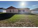Large backyard with a screened-in patio at 6608 Madeira Ave, Lakeland, FL 33811