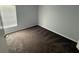 View of bedroom with plush carpet and window for natural light at 6608 Madeira Ave, Lakeland, FL 33811