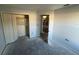 Bedroom featuring a closet, neutral walls and an entry leading to the hallway at 6608 Madeira Ave, Lakeland, FL 33811