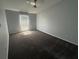 View of bedroom with plush carpet and window for natural light at 6608 Madeira Ave, Lakeland, FL 33811