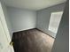 View of bedroom with plush carpet and window for natural light at 6608 Madeira Ave, Lakeland, FL 33811