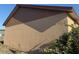 Beige stucco exterior home featuring brown wood trim at 6608 Madeira Ave, Lakeland, FL 33811