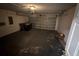 This garage features epoxy floors and an automatic garage door at 6608 Madeira Ave, Lakeland, FL 33811