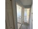 Hallway offering a view of the renovated bathroom and bedroom at 6608 Madeira Ave, Lakeland, FL 33811