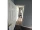 Neutral hallway with light wood look floors and paint at 6608 Madeira Ave, Lakeland, FL 33811