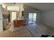 Bright kitchen area featuring sliding glass doors and a breakfast bar, prepped for remodeling at 6608 Madeira Ave, Lakeland, FL 33811