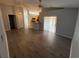 Spacious living room with hardwood floors and neutral paint at 6608 Madeira Ave, Lakeland, FL 33811
